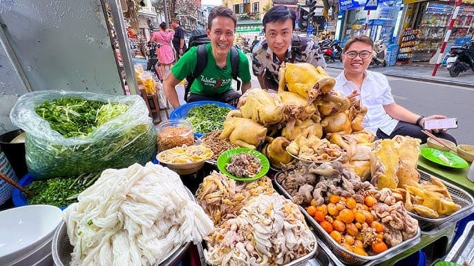 Chowing down on pho with my Ha Giang Easy Rider&mdash;fuel for a day of riding through those gorgeous fields