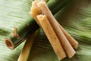 Hand peeling Com Lam bamboo sticky rice, a Sapa street food favorite