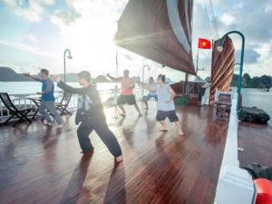 Passengers practicing tai chi on Bhaya Classic cruise deck