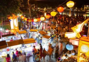 Dive into the Must-Try Foods in Hoi An with vibrant street stalls and lantern-lit charm.