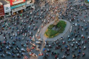 A large swarm of motorbikes on a busy road in Ho Chi Minh City, showing the typical urban transportation in Vietnam. (1) (1)