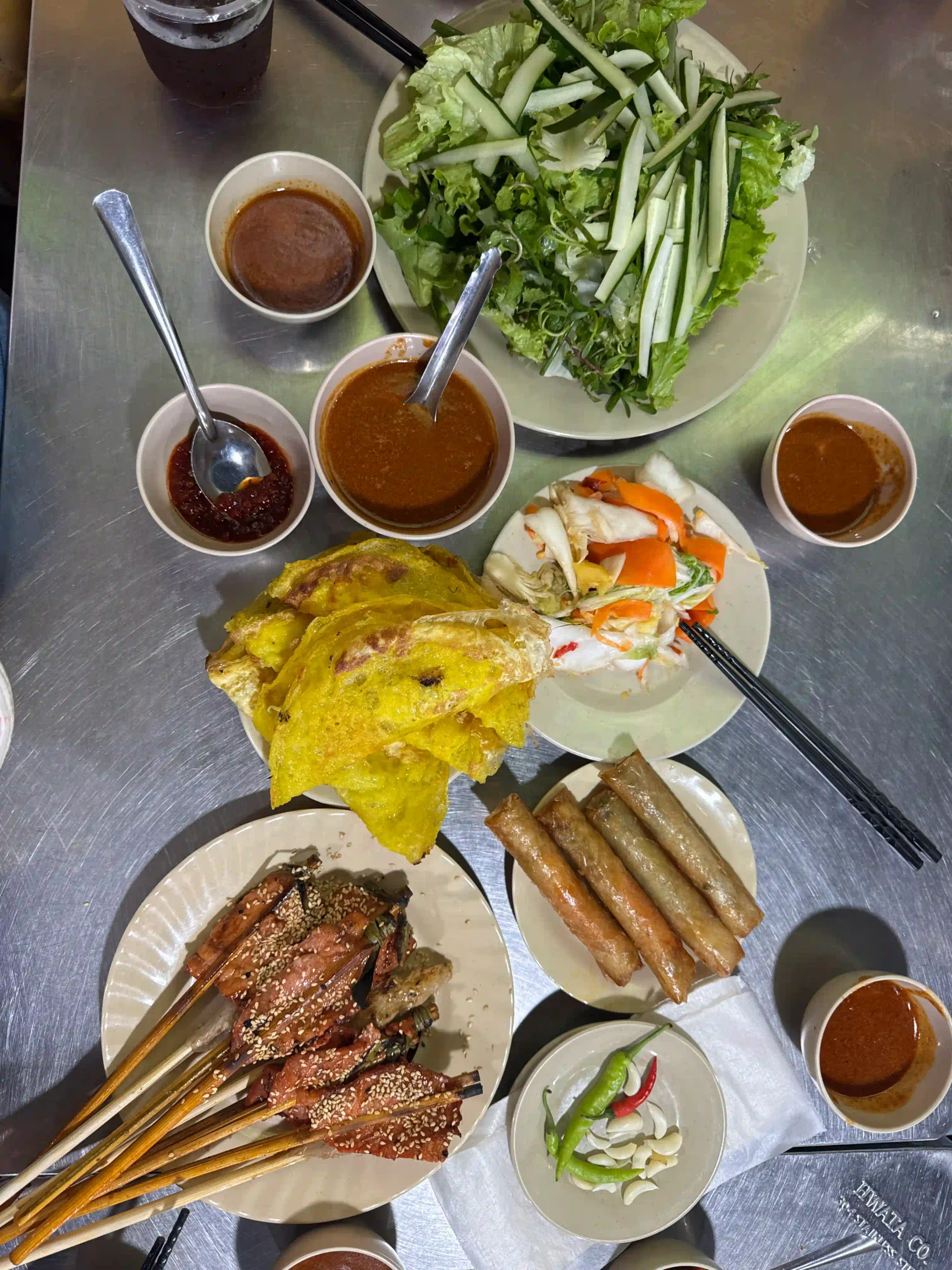 Is a Hoi An evening walking food tour worth the money? 15 Banh xeo nem lui grilled pork crispy spring rolls ba le well hoi an food tour scaled Vietadvisor