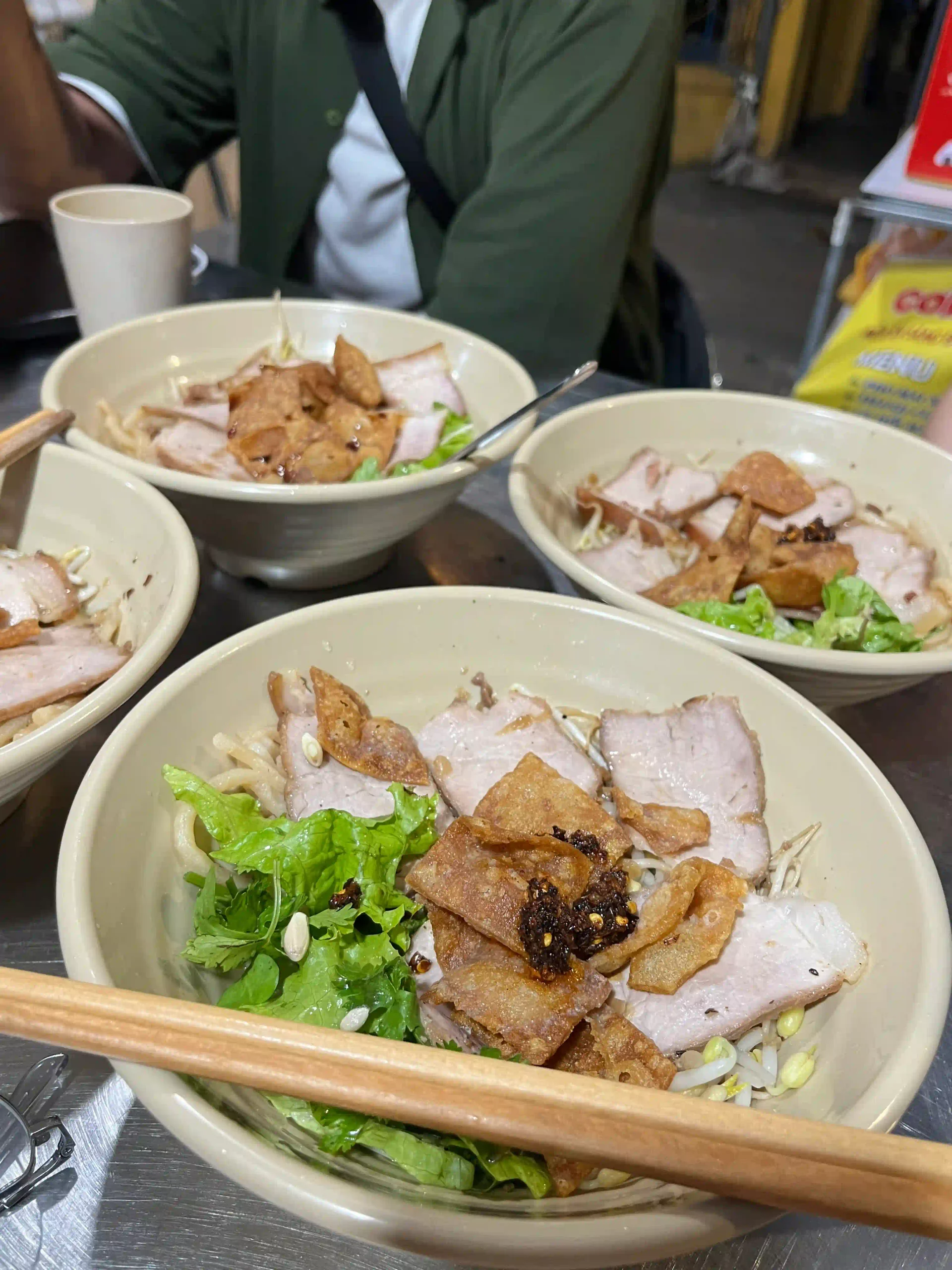 Is a Hoi An evening walking food tour worth the money? 3 Being told what youre eating while its in front of you cao lau hoi an food tour scaled Vietadvisor