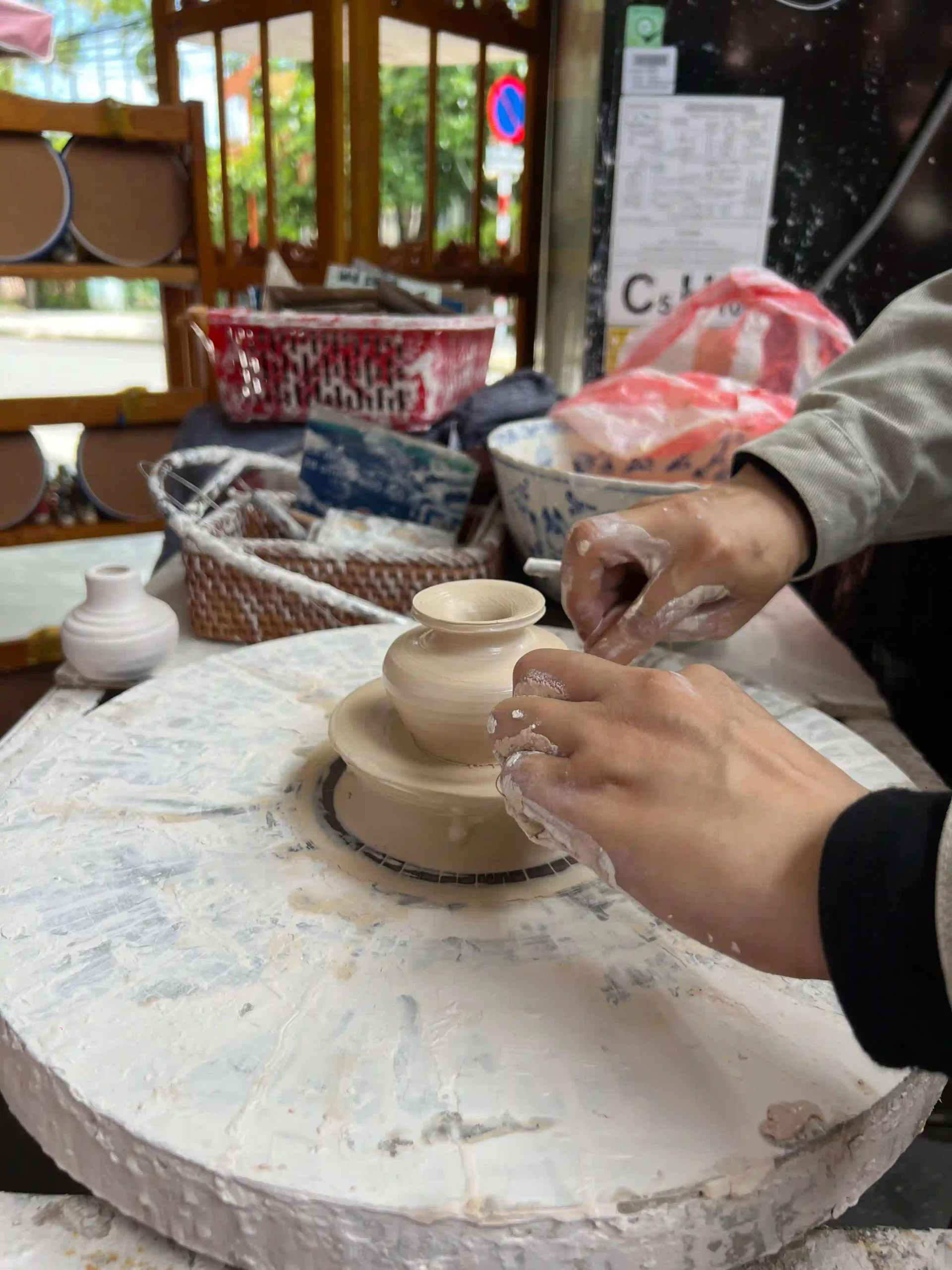 How to visit Thanh Ha Pottery Village Hoi An (self-guided) 21 family at Ceramic Village Museum 6 scaled Vietadvisor