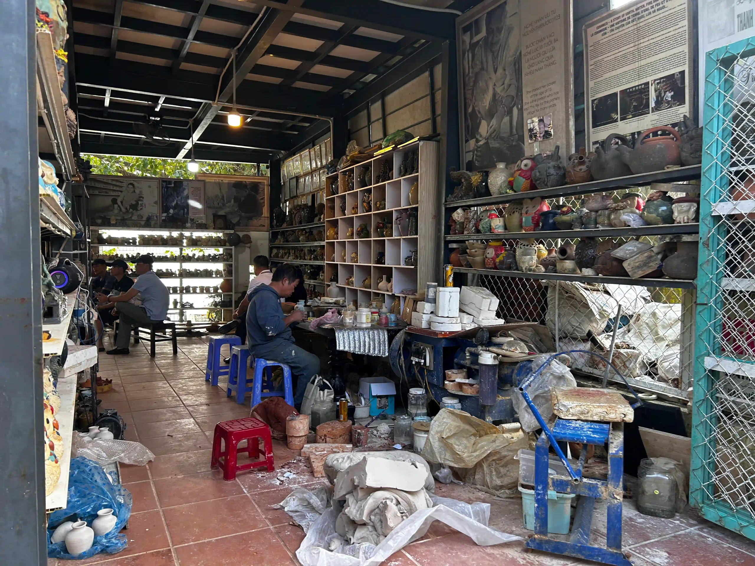 How to visit Thanh Ha Pottery Village Hoi An (self-guided) 25 family at Ceramic Village Museum scaled Vietadvisor